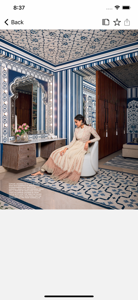 Architectural Digest - Elegant room with blue and white patterns and a vanity mirror featured in the Architectural Digest app