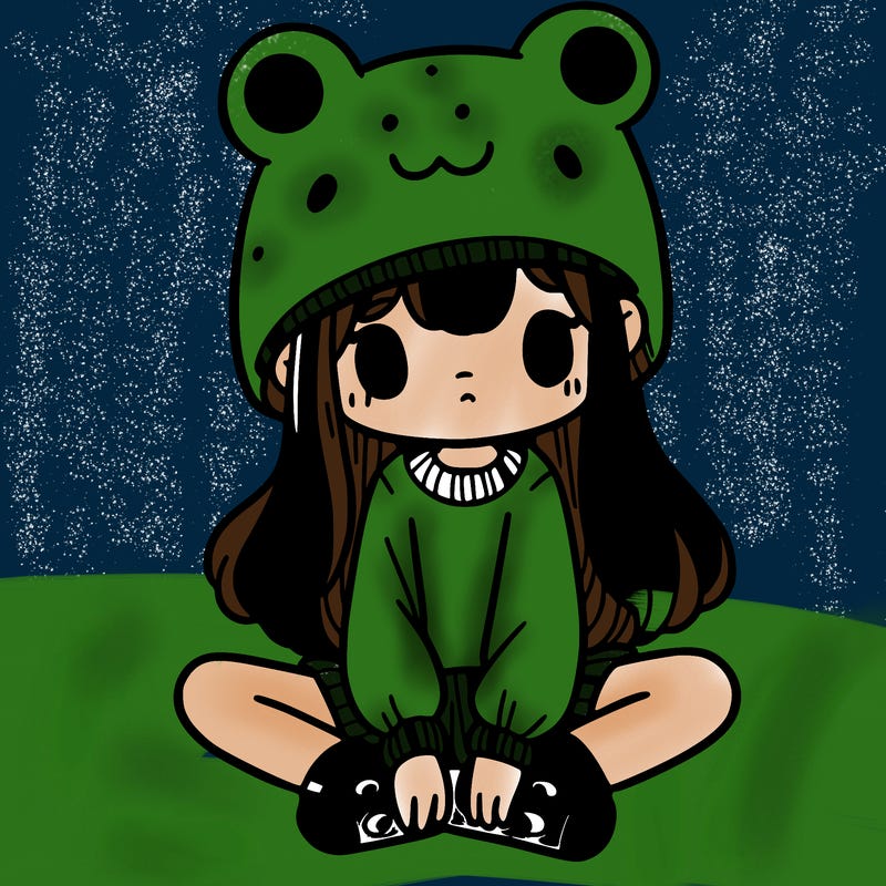 a girl wearing a frog hat and some frog socks