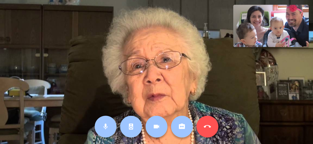 CareWindow - An elderly woman video calling her family through the CareWindow app interface