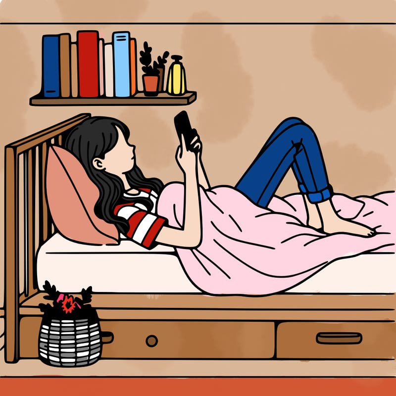 a girl laying on her bed with her phone