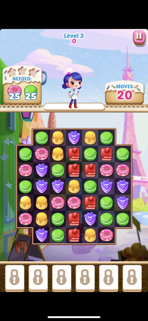 Gameplay screenshot of Cupcake Mania showing a match 3 grid with colorful donuts and macarons