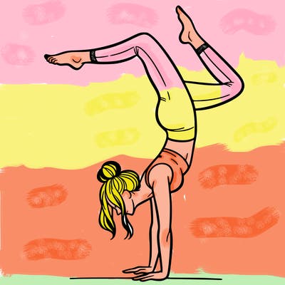 a woman doing a handstand
