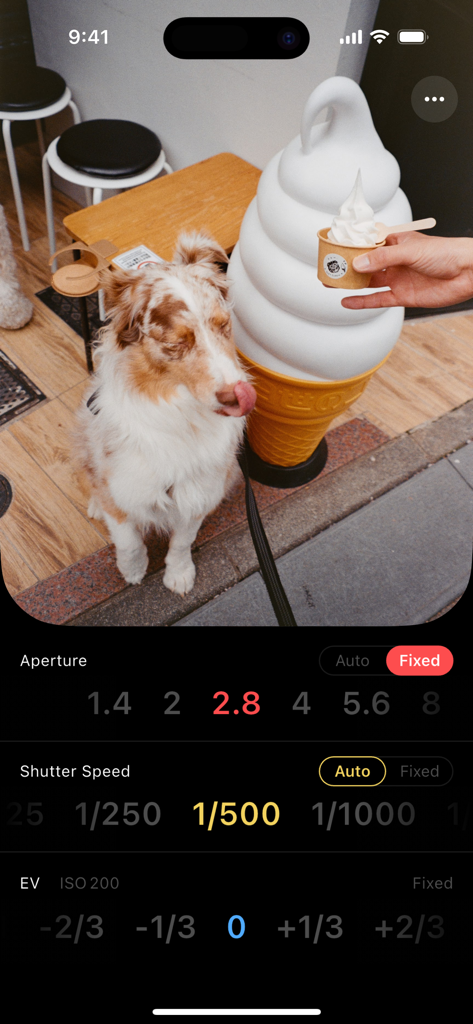 LX - Light Meter - LX Light Meter app interface displaying aperture and shutter speed controls over a live camera view of a dog
