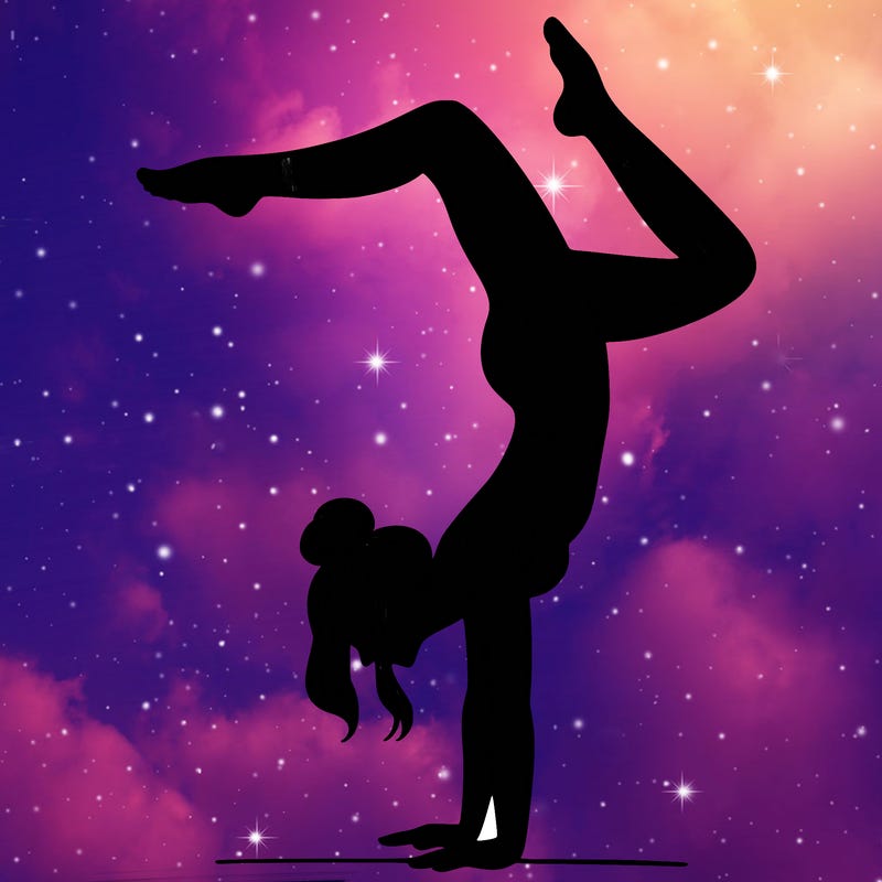 a woman doing a handstand