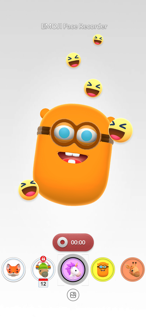 Interface de l'application EMOJI Face Recorder montrant un personnage orange avec des lunettes et des emojis rieurs flottants pendant une session d'enregistrement vidéo