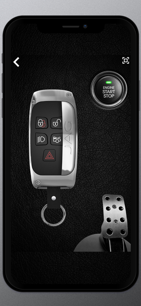 Keys and engine sounds of cars - A digital Jaguar car key fob and engine start stop button on a leather background