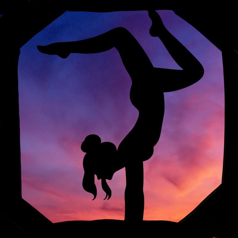 a woman doing a handstand