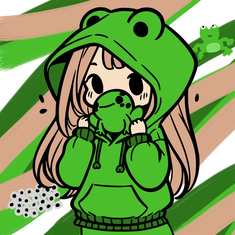 a girl holding a froggy hoodie