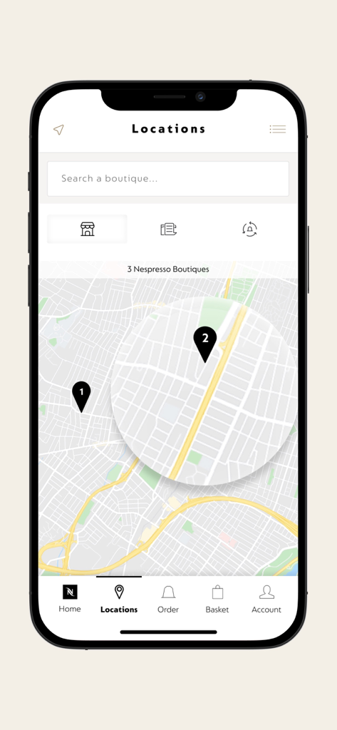 Écran de l'application mobile Nespresso affichant une carte avec les boutiques à proximité
