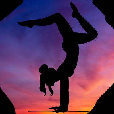 a woman doing a handstand