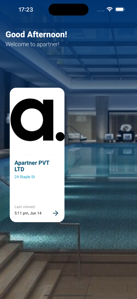 The welcome screen of the Apartner luxury living app featuring an indoor swimming pool background and a property selection card.