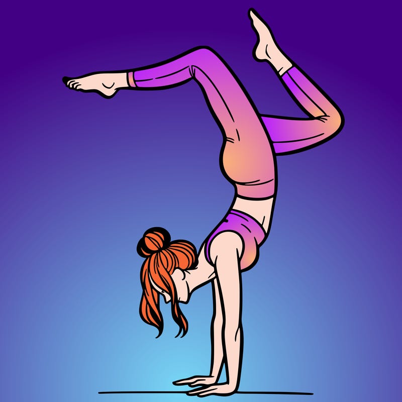 a woman doing a handstand