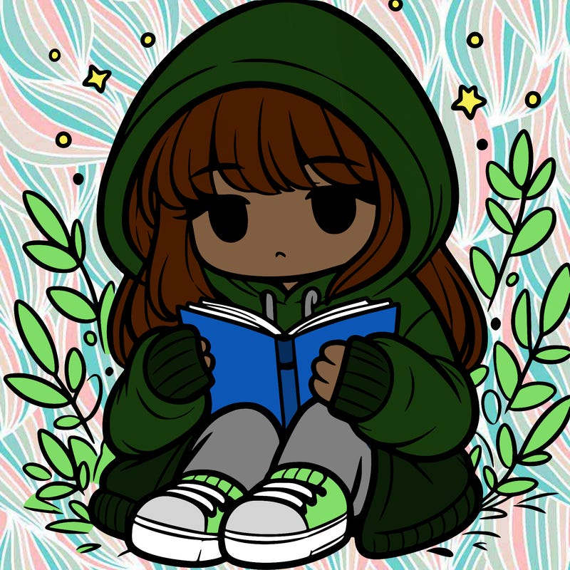 girl in oversized hoodie reading a book