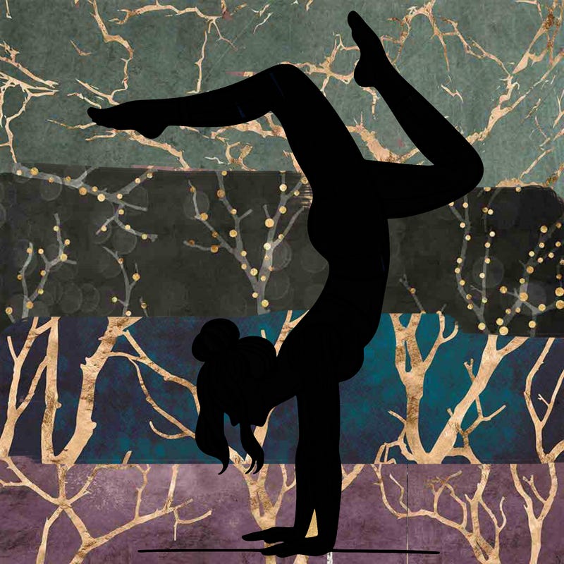a woman doing a handstand