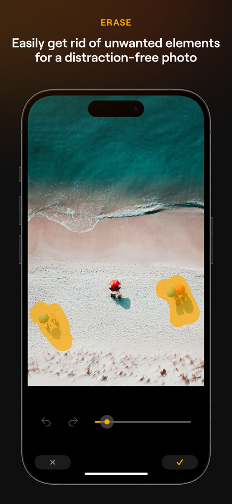 Luminar Mobile AI Photo Editor interface showing the Erase tool being used to remove unwanted objects from a beach scene
