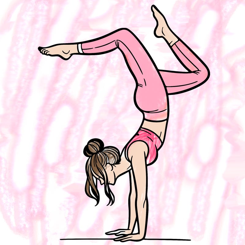 a woman doing a handstand