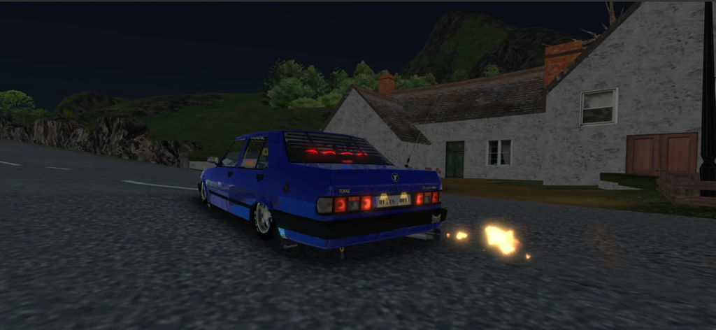 A blue modified Tofas Dogan car with exhaust fire at night