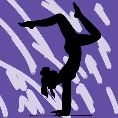 a woman doing a handstand