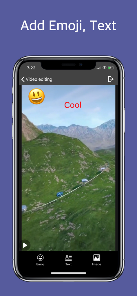 Video Clip Editor - Film maker - A smartphone screen showing the Video Clip Editor app interface with a smiley emoji and text added to a video clip of a mountain landscape.