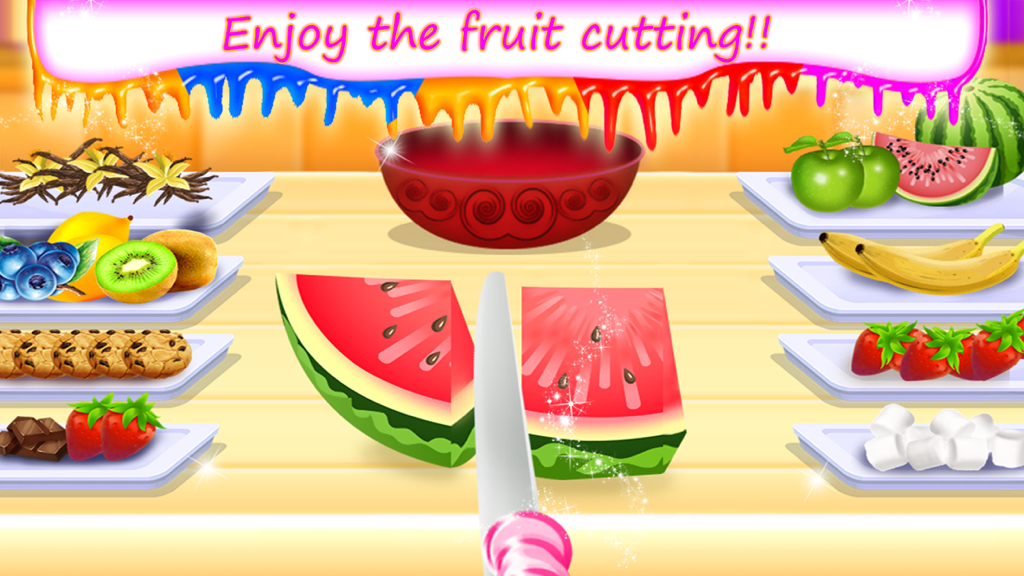 My Frozen Milkshake Party - いちごやチョコレートなどのフルーツやミルクシェイクの材料がたくさんある画面で、ナイフがいちごを半分に切っている様子