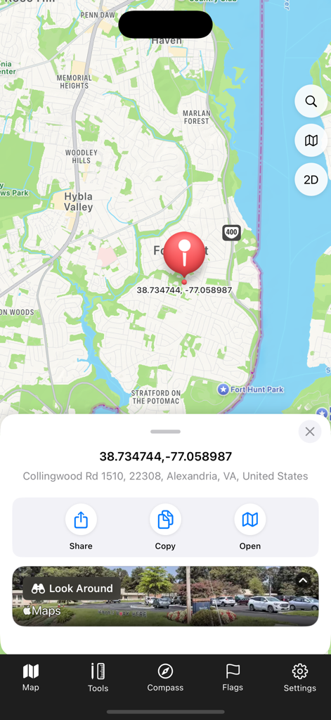 A screenshot of the Satellite Map app displaying geographical coordinates and a red pin for a location in Alexandria Virginia
