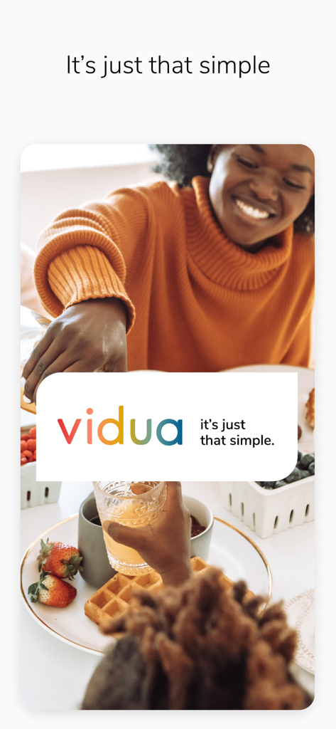 Vidua - A smiling woman at breakfast showing the Vidua logo with the slogan its just that simple