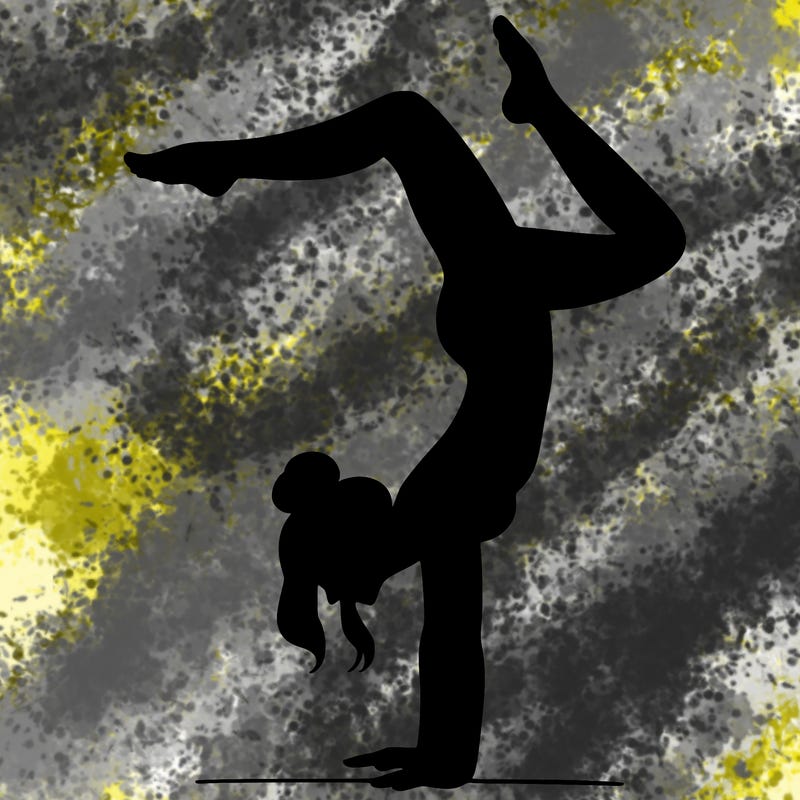 a woman doing a handstand