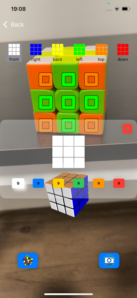 Magic Cube Solver 5x 3x 4x 2x - A smartphone camera scanning a physical Rubik cube with augmented reality color detection for automated solving.