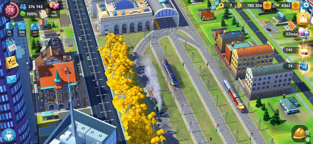 SimCity BuildIt - Vista aerea della disposizione di una città con una stazione ferroviaria e una rete di binari in SimCity BuildIt