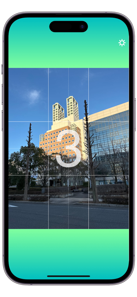 AutoShot Camera - AutoShot Camera app screen showing a three-second countdown timer and composition grid over a city building.