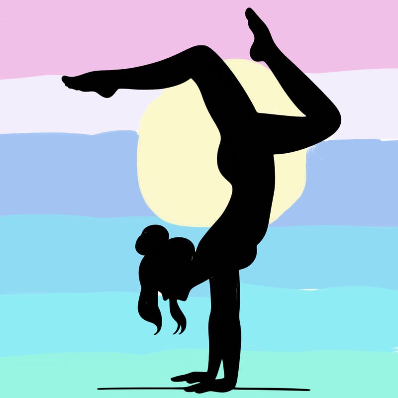 a woman doing a handstand