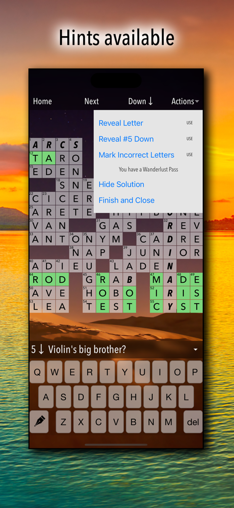 Crossword Puzzles! - A crossword puzzle game screen showing available hints and a beautiful sunset background.