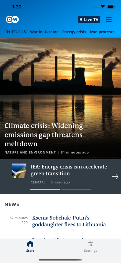 DW news app home screen showing articles on climate change and world news