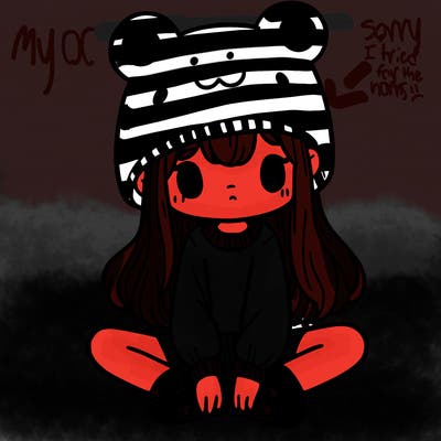 a girl wearing a frog hat and some frog socks