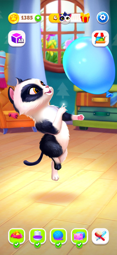 Black and white virtual kitten playing with a blue balloon