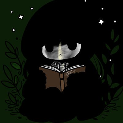 girl in oversized hoodie reading a book