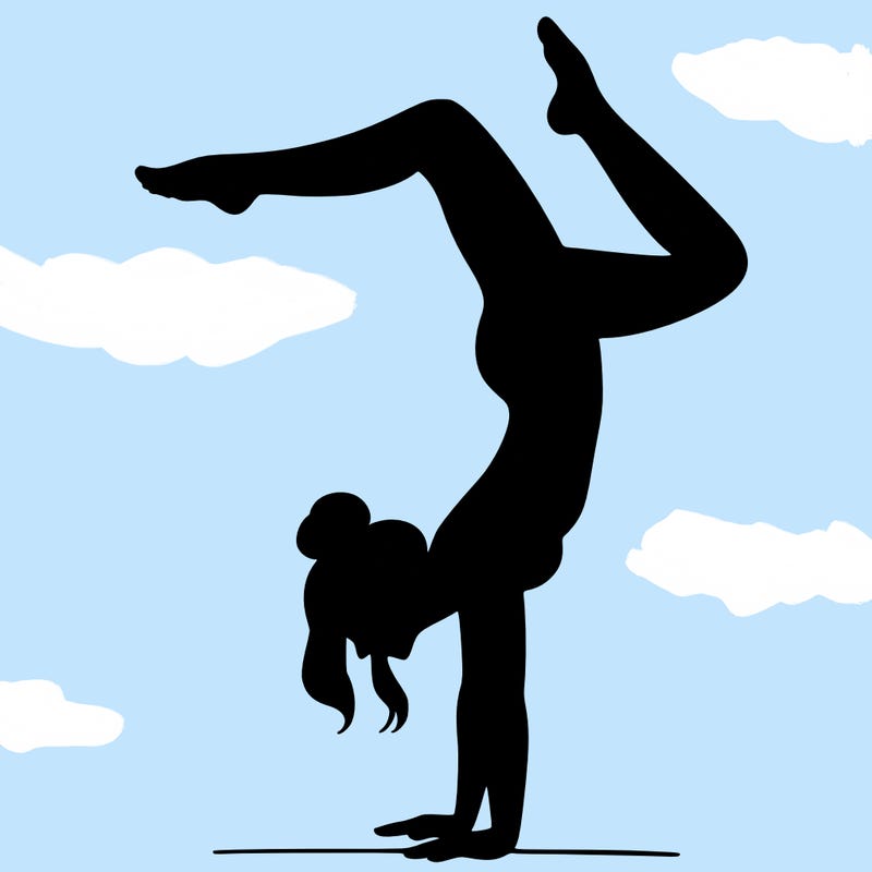 a woman doing a handstand
