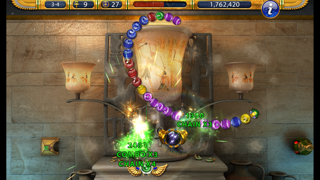 Jugabilidad de Luxor 2 HD mostrando una cadena de disparos de mármoles con puntos de combo y cadena en un escenario del Antiguo Egipto.