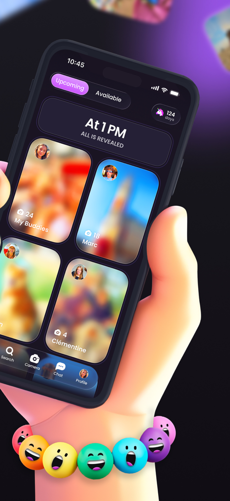 A hand holding a smartphone showing the Buddies app interface with blurred social photos scheduled for a 1 PM reveal