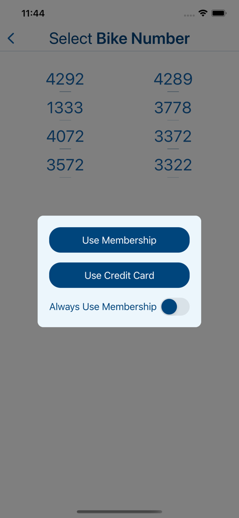 Citi Bike Miami app interface showing bike number selection and a prompt to choose between membership or credit card payment.