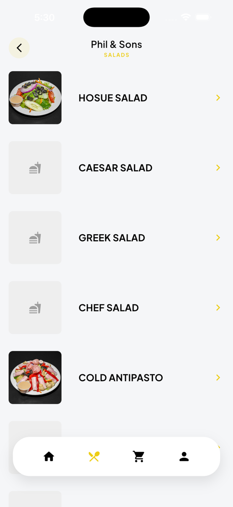 Interfaz de la aplicación móvil Phil and Sons que muestra el menú de ensaladas, incluyendo ensalada de la casa, ensalada César y antipasto frío con imágenes y precios