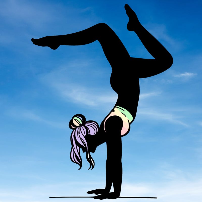 a woman doing a handstand