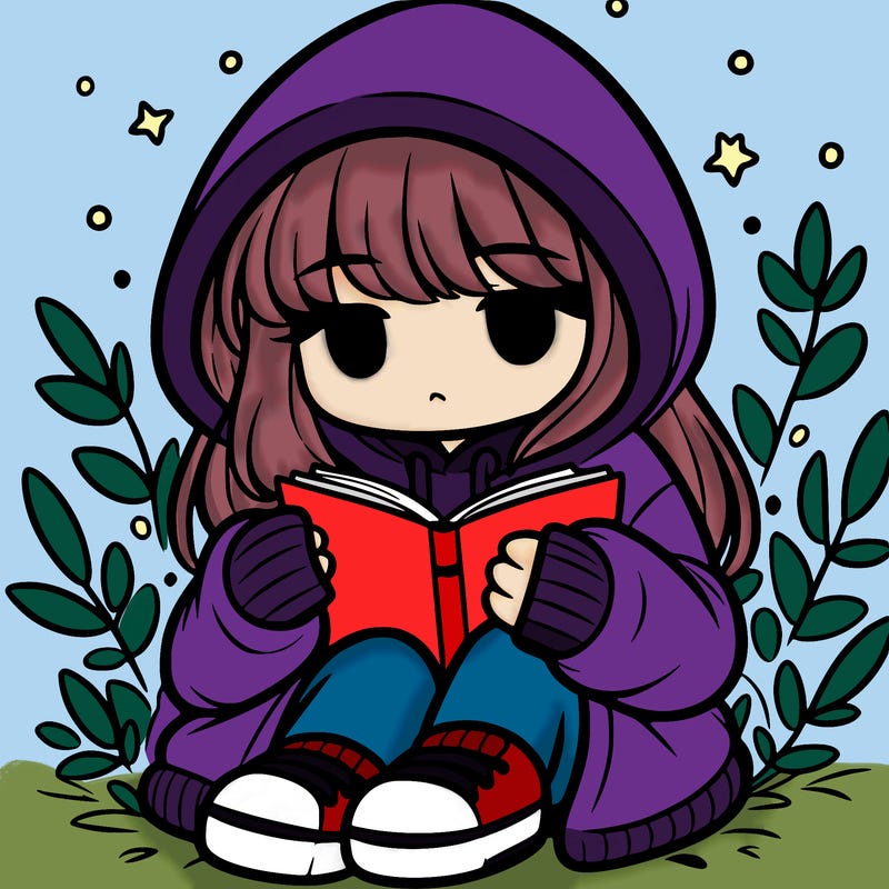 girl in oversized hoodie reading a book