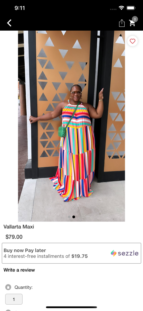 A woman wearing a colorful striped Vallarta Maxi dress on the IMarE Boutique app