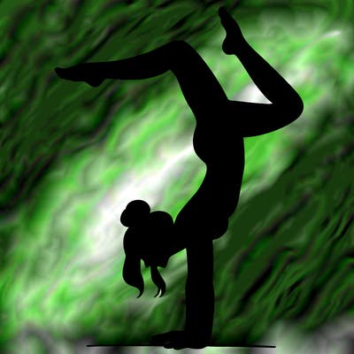 a woman doing a handstand
