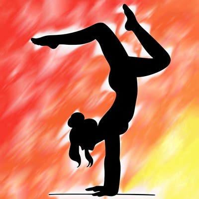 a woman doing a handstand