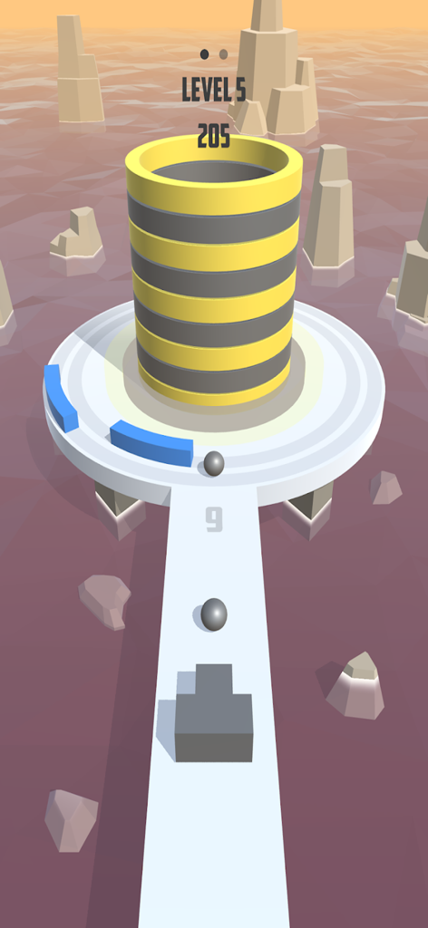 Fire Balls 3D - Fire Balls 3Dで、黄色と黒の縞模様のタワーと回転する障害物をターゲットにするボールシューターが表示されているモバイルゲーム画面。