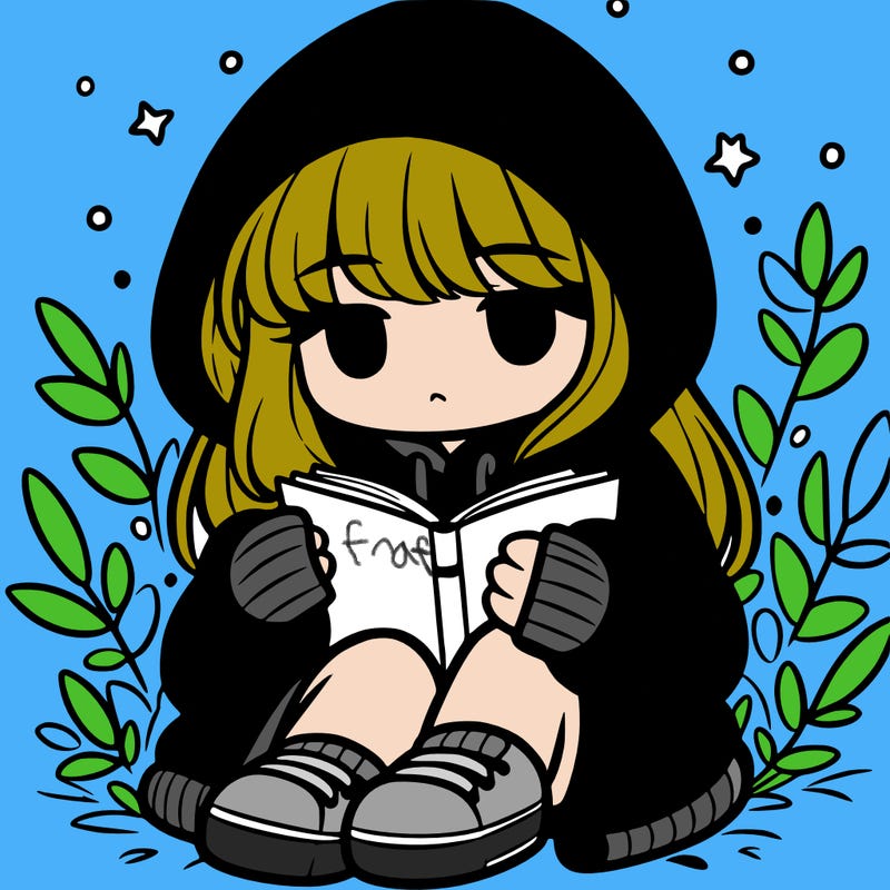girl in oversized hoodie reading a book