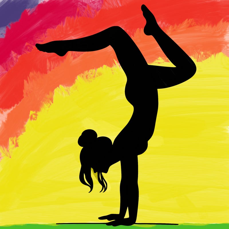 a woman doing a handstand