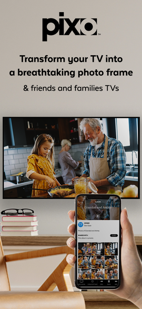 A hand holding a smartphone to display a family photo slideshow on a living room TV using the Pixo app